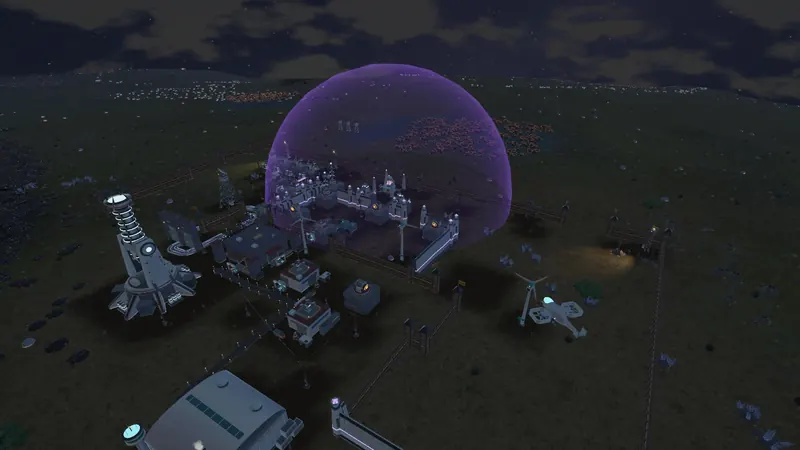 A shield dome over a base at night